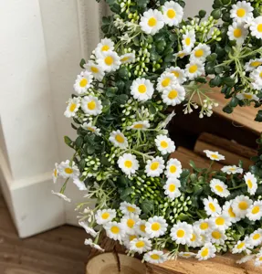 Detailed macro shot of white artificial daisy flowers on an Easter home decor wreath