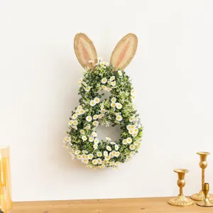 Detailed view of the Easter bunny wreath made with white daisies and burlap ears