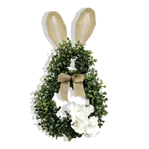 Detailed view of artificial boxwood Easter bunny wreath with burlap bow and hydrangea