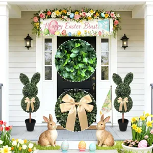 Artificial Easter bunny topiary plant with gold bow detail and lush leaf texture