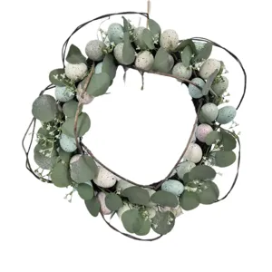 Decorative Easter wreath with speckled eggs and eucalyptus for front door decor
