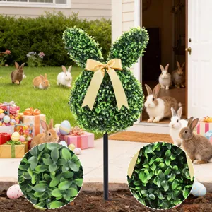 Detailed macro view showing the realistic texture of artificial boxwood rabbit topiary.