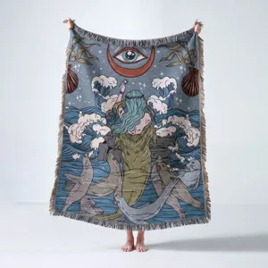 Woven bohemian throw blanket with artistic mermaid and sea lion illustration detail
