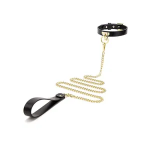 Black leather choker necklace with gold chain and handle set for alternative fashion wear.