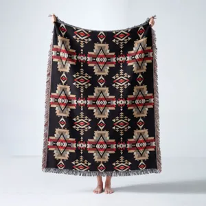 Detailed view of bohemian geometric pattern on ethnic style woven cotton throw blanket