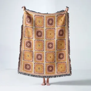 Full view of bohemian woven throw blanket with vintage floral square pattern and fringes
