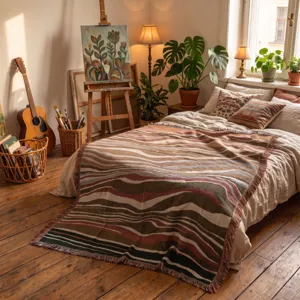 Close-up of cozy Bohemian woven throw blanket with wavy earth-tone patterns on a bedroom bed.