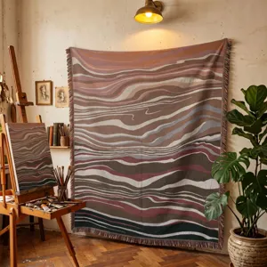 Bohemian abstract wave pattern woven blanket hanging on an art studio wall