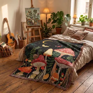 Bohemian woven blanket featuring magical mushrooms and moon in artistic bedroom setting