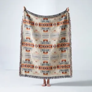 Detailed view of Bohemian Indian pattern woven throw blanket with decorative fringed edges