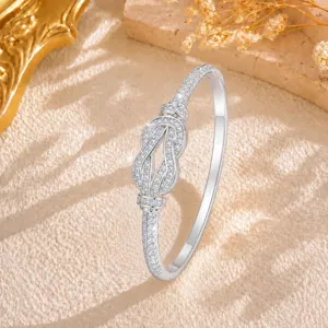 Close-up detail of the dazzling infinity knot diamond bracelet, sparkling crystal stones.