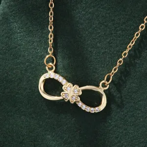 Gold infinity clover necklace detail featuring sparkling zirconia stones for gift.
