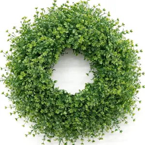 Detailed top view of a lush green artificial boxwood wreath for indoor home decor.