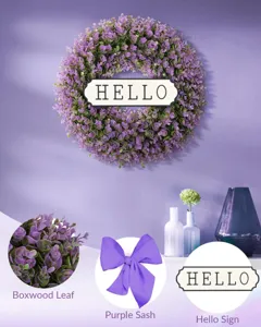 Detailed shots of purple boxwood leaves, silk sash, and hello sign on front door wreath