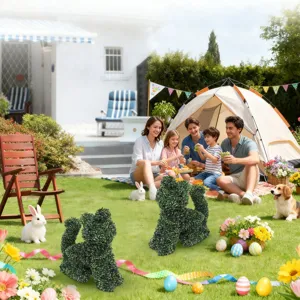 Pair of artificial dog-shaped boxwood topiary sculptures in a sunny garden picnic scene