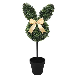 Decorative Easter bunny shaped topiary artificial plant with gold bow in a black pot