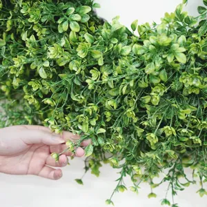 Detail view of lush green artificial boxwood plant leaves for home decor