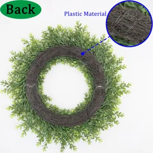 Close-up detail of the durable plastic backing on this green artificial boxwood wreath