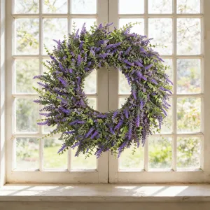 Realistic artificial lavender wreath hanging on a white grid window frame for home decor