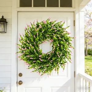 Simulation lavender and boxwood wreath hanging on a white front door for home decor