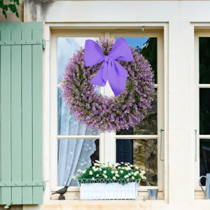 Decorative purple eucalyptus wreath with large bow for spring summer front door display