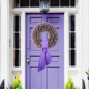 Exquisite purple eucalyptus wreath with long ribbon hanging on a lavender front door