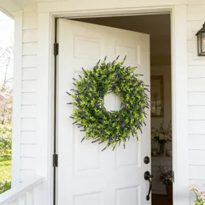 Lush artificial lavender and boxwood wreath displayed on a white wooden front door