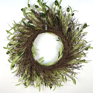 Detailed macro view of an artificial olive leaf wreath with realistic green fruits