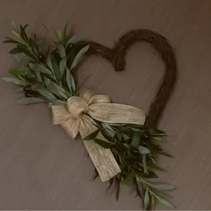 Rustic heart-shaped artificial olive leaf wreath with burlap bow for front door decor