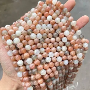 Close-up of natural mixed moonstone and sunstone round beads for jewelry DIY