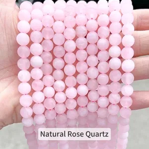 Close-up of matte pink rose quartz round beads for DIY jewelry making