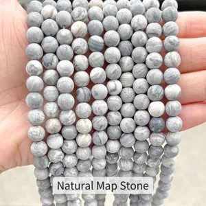 Macro view of matte natural map stone round beads with unique grey marbled textures