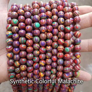 Macro detail of synthetic colorful malachite beads showing vibrant striped patterns for DIY