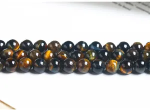 Macro detail of natural blue and yellow tiger eye stone beads for DIY jewelry making