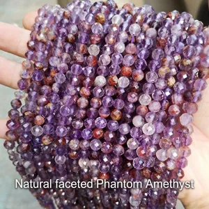 Macro shot of natural faceted purple phantom quartz loose beads for DIY jewelry making