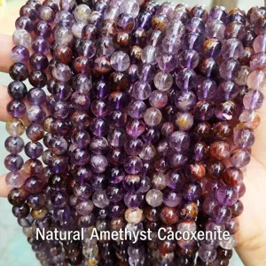 Close-up view of natural purple phantom quartz crystal beads showing unique inclusions