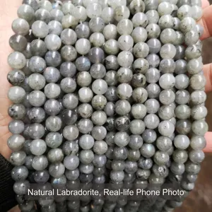 Close-up of natural grey labradorite loose round beads for DIY jewelry