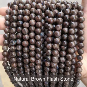 Macro detail of natural coffee-colored labradorite flash stone round beads for DIY jewelry