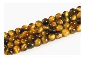 Detailed close-up of natural 5A yellow tiger eye round stone beads for jewelry DIY
