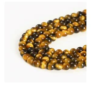 Macro view showing the natural chatoyancy of yellow tiger eye round stone beads