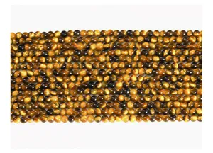 Close-up detail of natural yellow tiger eye stone round beads for DIY jewelry making