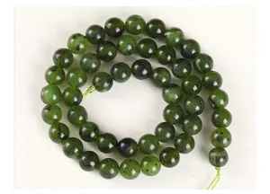 Close-up of natural Canadian Nephrite Jade round beads showing unique mineral texture
