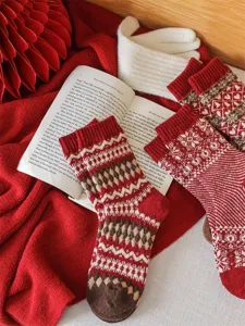 Cozy vintage Fair Isle winter wool socks in red and white with classic geometric pattern.
