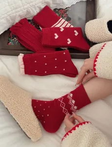 Red wool thickened cozy mid-tube socks with cute heart and geometric patterns for winter.