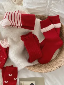 Cozy red wool thick mid-tube socks for women winter warmth cute heart striped design comfortable