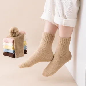 Kids cozy fuzzy sleep socks, thick plush winter thermal mid-tube socks for girls warmth.
