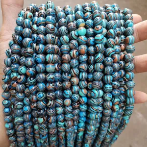 Macro detail of synthetic blue malachite loose beads for personalized DIY jewelry making