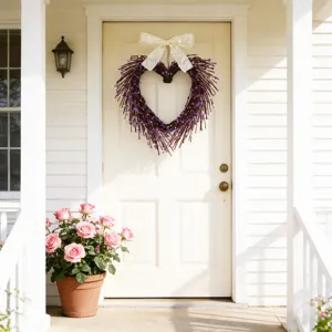 Handmade heart-shaped purple twig wreath with elegant white bow decoration on front door