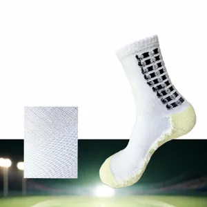 Detail view of professional football socks featuring breathable mesh and cushioned towel sole.