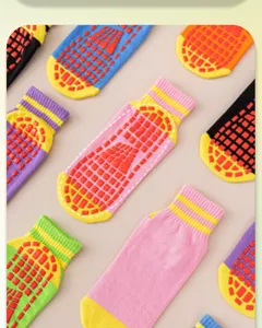Colorful non-slip grip socks with rubber dots for indoor trampoline, yoga, and fitness use.